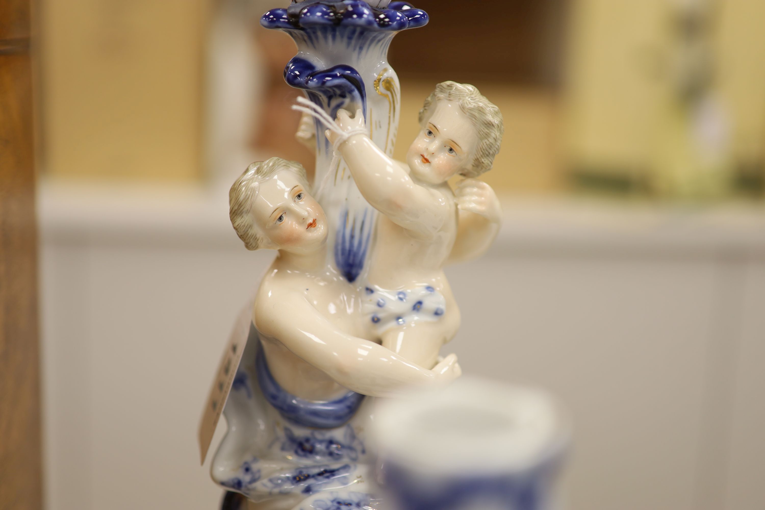 A pair of Sitzendorf figural porcelain candelabra, height 47cm